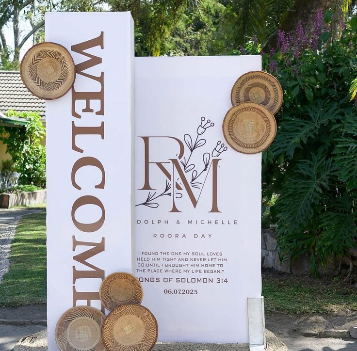 Roora welcome board on an easel with woven baskets