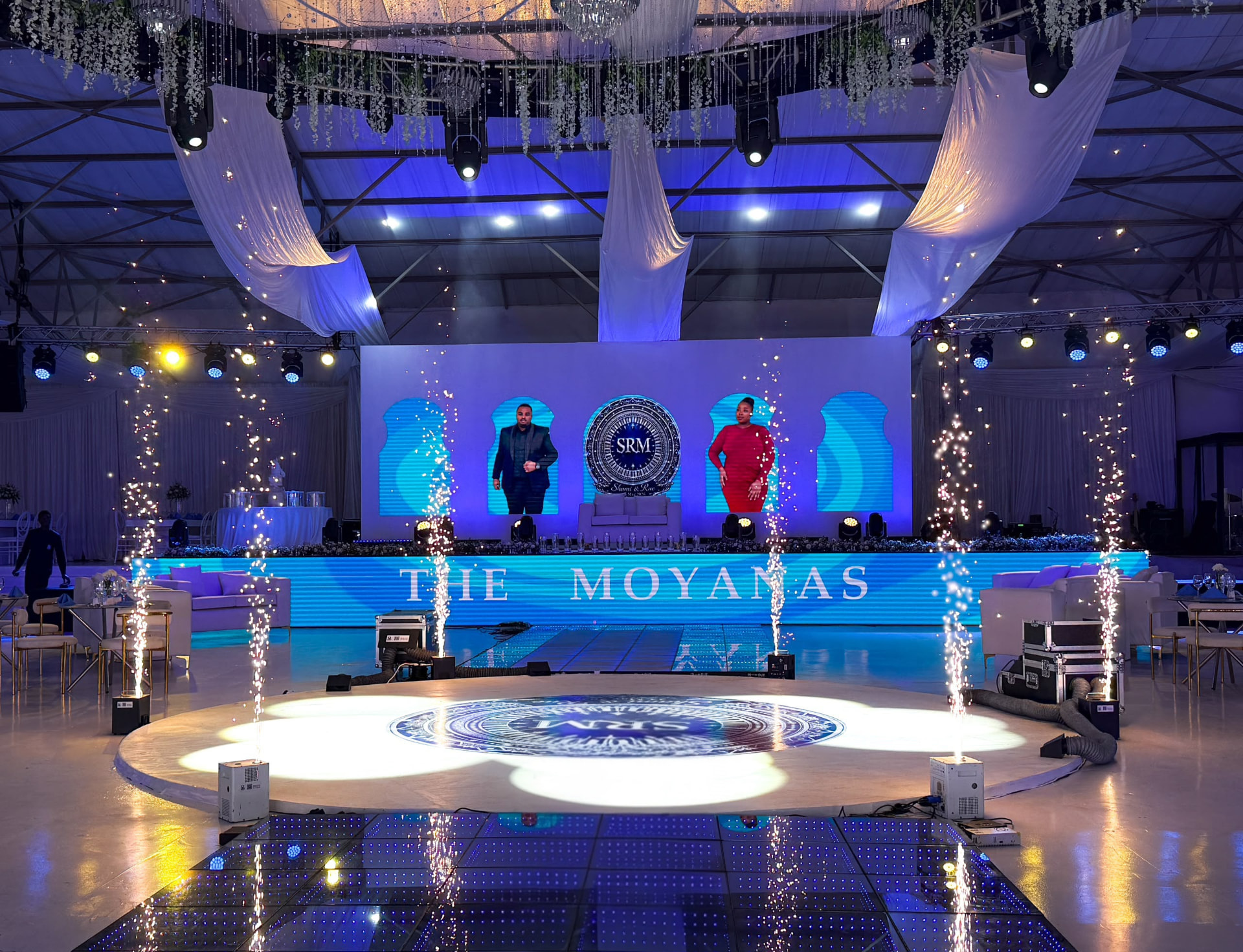 Event stage with sparkle light fountains and an illuminated dance floor