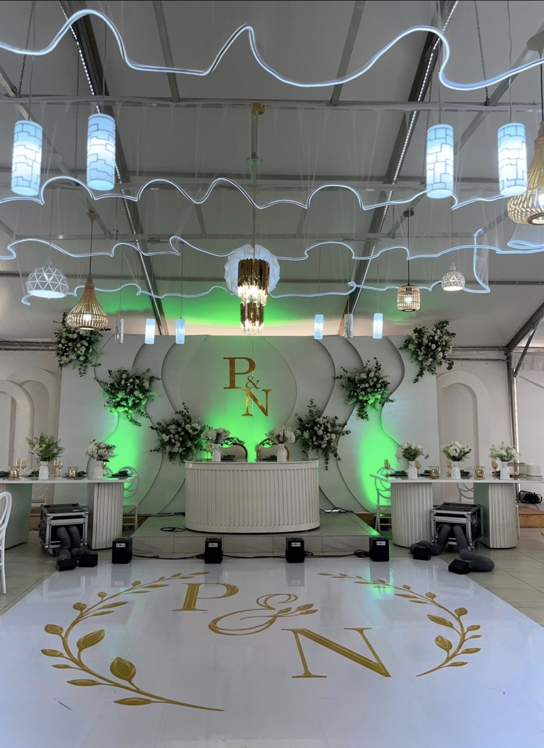 Monogrammed floor wrap at a reception with mood lighting