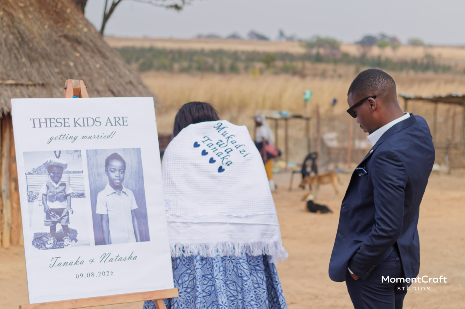 Lobola welcome board with childhood photos of the couple, photographed by MomentCraft Studios