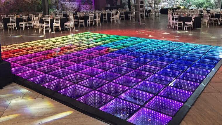 Illuminated multicolour LED dance floor set up in a banquet hall