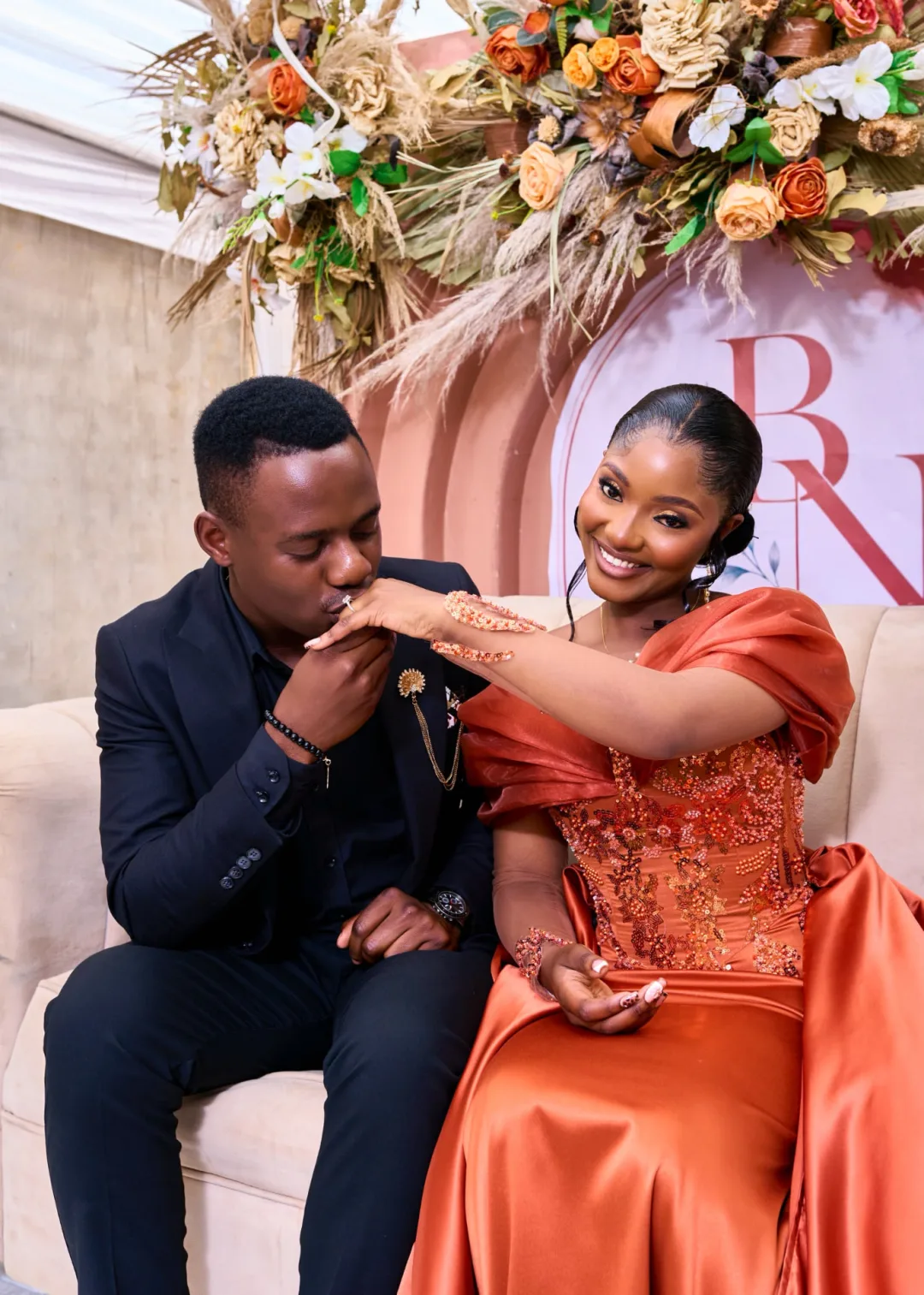 Brendon kisses Naomi's hand during the roora ceremony in Harare