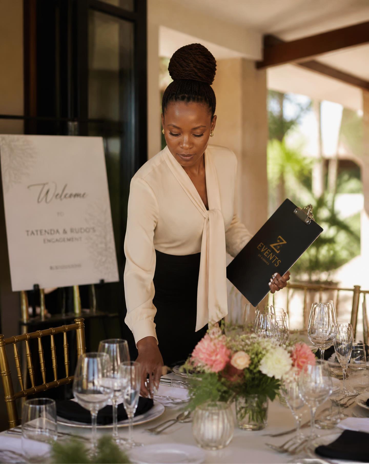 Caronai Events planner styling a table before guests arrive